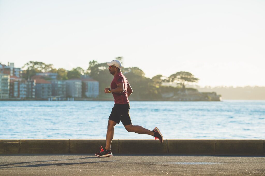 man running at sea bay