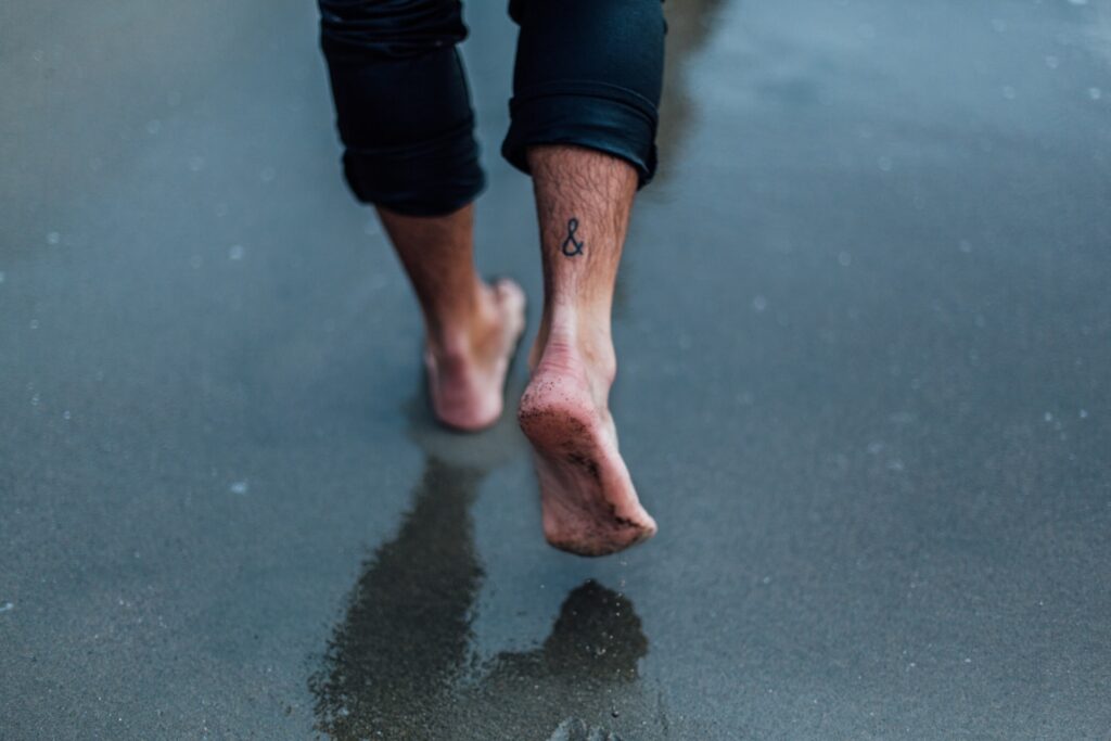 barefoot men heels on the beach